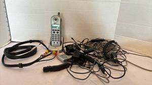 lot 3115 image: Motorola C8 Digital Cell Phone with Assorted Cables and Accessories