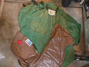 lot 3402 image: 4 Treegators.  Low Profile Portable Drip Irrigation System.  Brown one is horseshoe shaped.   3 Green ones are not.  See pictures