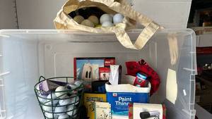 lot 3525 image: Tub of golf balls, accessories and moreIncludes a Golf Distance Finder
