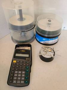 lot 3615 image: Texas Instruments TI-30XA Scientific Calculator with DVD Spindles and Magnetic Trinket