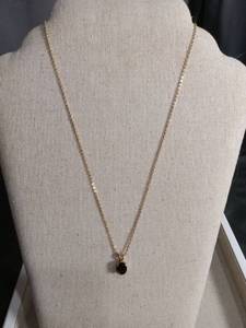 lot 5945 image: Gold Tone Chain Necklace with Black Stone Pendant