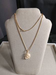 lot 5956 image: Gold Tone Chain Necklace with Ivory Rose Pendant