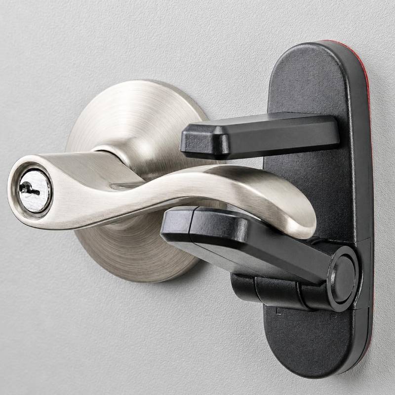 lot 3124 image: Door Lever Lock (2 Pack) Prevents Toddlers from Opening Doors. 3.25 L  1.5 W  4.5 H Easy One Hand Operation for Adults. Durable ABS with 3M Adhesive Backing. Simple Install, Black - Retail $13