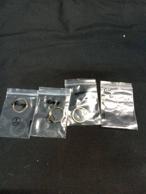 lot 5239 image: Pack of 4 Gold Bands  Size 6&nbsp