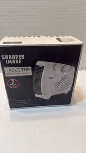 lot 1036 image: Sharper Image table top adjustable heater new in box