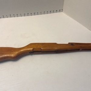 lot 1075 image: Wooden rifle stock barrel