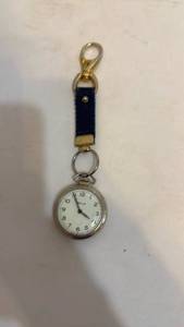 lot 1147 image: Bulls Eye pocket watch and key chain