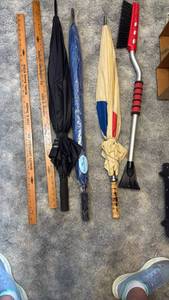 lot 1151 image: Umbrellas, ice scraper and yard sticks