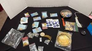 lot 1386 image: Pocket change tray, assorted pens, charms and more