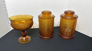 lot 1403 image: Indiana Glass Tiara Amber Sandwich glass  canisters and footed compote