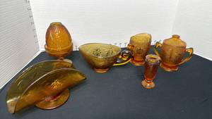lot 1405 image: Indiana Glass Tiara Amber Sandwich glass creamersugar, gravy boat, napkin holder and 2 pc candle holder