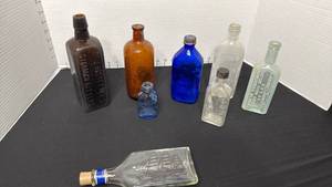 lot 1422 image: Antique medicine bottles and Avon cologne bottle