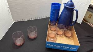 lot 1442 image: Plastic pitcher and cups with juice glasses