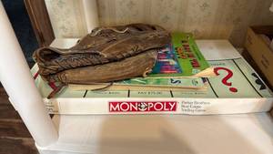 lot 1911 image: Monopoly game, Wilson softball glove and coloring books