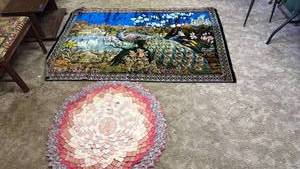 lot 2008 image: Tapestry 4 ft x 6 ft and round flower rug 36 inch diameter located in basement