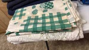 lot 2011 image: Tablecloths located in basement