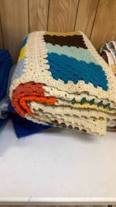 lot 2013 image: Crochet afghans located in basement