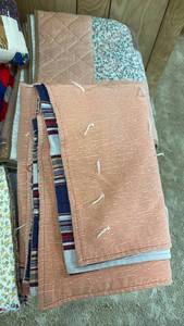 lot 2014 image: Comforters and lap quilt located in basement