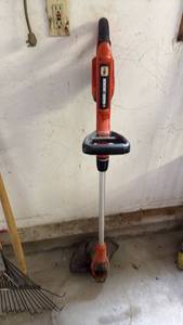 lot 3003 image: Black and Decker battery operated weed eater with charger