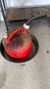 lot 3069 image: Gas can and oil pan