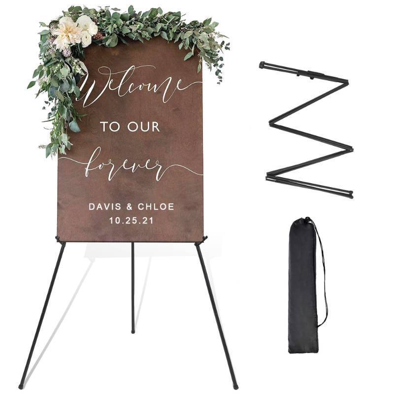 lot 24993 image: DANMO Easel Stand for Wedding Sign Poster 63 Instant Display Easel for Floor Adjustable Metal Art Easel Black - Retail $17
