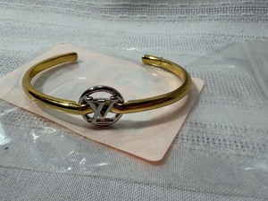 lot 25115 image: LVL 5 Replica Louis Vuitton Gold Tone Metal Bangle