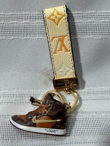 lot 25127 image: LVL 5 Replica Louis Vuitton Sneaker Keychain