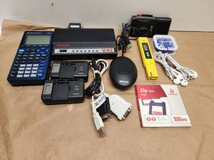 lot 25 image: Mixed Electronics Bundle with USRobotics Modem, TI-81 Calculator, and Accessories