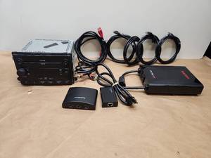 lot 35 image: Mixed Electronics Lot - Ford CD6 MP3 Car Radio, RadioShack HDMI Switch, TP-Link Adapter, Ricoh Next Gen PCS Power Conditioner & Cables