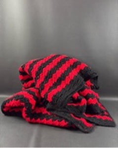 lot 50 image: Soft Red and Black Crochet Afghan Blanket