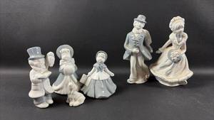 lot 154 image: Ice Skating Figurines with Childrens Choir and Puppy Tallest is Approximately 7 inches