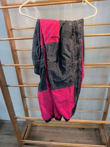 lot 81 image: The North Face Black & Pink Color Block Snow Pants