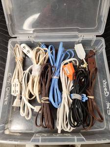lot 1051 image: Lot of Assorted Indoor Extension Cords in Storage Bin
