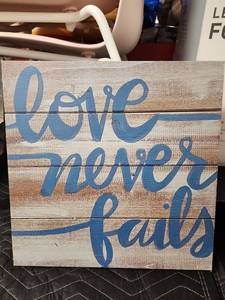 lot 1065 image: Love Never Fails Rustic Wood-Look Canvas Wall Art