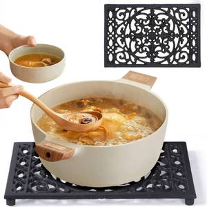 lot 6931 image: Notakia 9.6 x 6.3 Inch Cast Iron Trivet Set, Large Metal Trivets for Hot Dishes Pots Pans Decorative Kitchen Trivets, Heat-Resistant Trivet Mats for Quartz Countertops, Table Cooktop (Black, 2 Pack)
