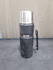 lot 1399 image: Thermos Brand Stainless Steel Insulated Vacuum Bottle with Handle