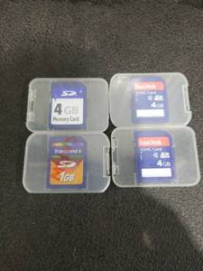 lot 1436 image: Lot of 4 SD Memory Cards with Cases - SanDisk 4GB x2, Generic 4GB, Transcend 1GB