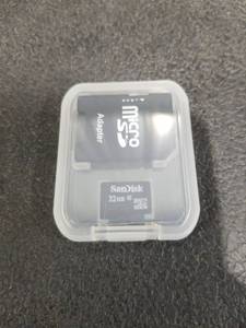 lot 1438 image: SanDisk 32GB Micro SD Card with Adapter and Case