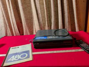 lot 118 image: RCA VR480 4-Head VHS VCR with Remote and Owners Manual