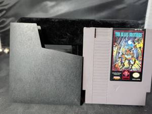 lot 174 image: The Blues Brothers NES Cartridge with Dust Sleeve