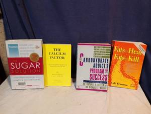 lot 297 image: Lot of 4 Health & Nutrition Books - Sugar Solution, Calcium Factor, Carbohydrate Addicts, Fats That Heal Fats That Kill