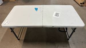 lot 2040 image: White Plastic Folding Table with Metal Legs 4�� Long,2�� Wide.