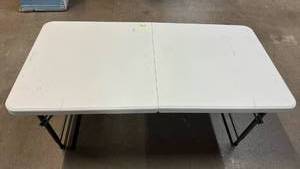 lot 2041 image: Folding White Table with Metal Legs 4�� Long 2��Wide.