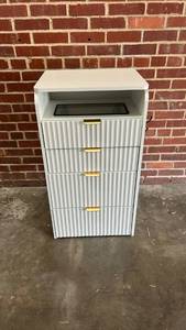 lot 8008 image: White Ridged Storage Vanity with Pull-out Stool, Glass Display Shelf, Light Up Mirror and Power Supply