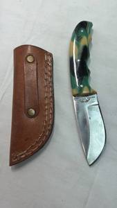 lot 151 image: Old Ram Fixed Blade Hunting Knife with Camo Handle and Tooled Leather Sheath