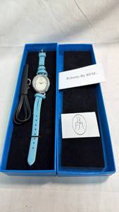 lot 232 image: Roberto by RFM Womens Oval Crystal Accent Watch with Blue Leather Strap