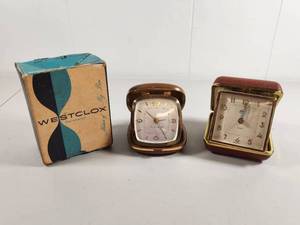 lot 115 image: Three Folding Travel Alarm Clocks