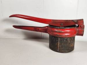 lot 176 image: Red Metal Potato Ricer Press