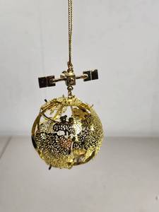 lot 197 image: Gold-Tone Filigree World Globe Ornament with Satellite Detail