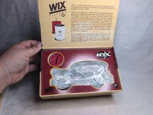 lot 2601 image: Wix Filters 60th Anniversary 1939 Chevrolet Canopy Panel Truck & Era Oil Filter Bank Die-Cast Gift Set